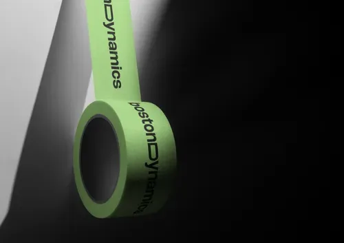 Roll of green branded tape reading Boston Dynamics